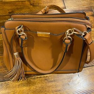 Tan purse/ multiple pockets, handles or over the shoulder strap.